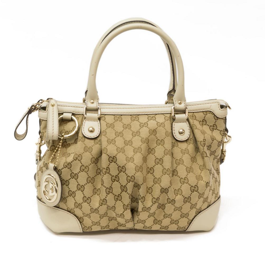 GUCCI 'SUKEY' MONOGRAM CANVAS & LEATHER SATCHEL: Gucci â€œSukey Top Handle” tote, in beige monogram canvas, with gold-tone hardware, leather trim, dual rolled handles, zipper closure at top opening to tonal canvas lined interior with dual 