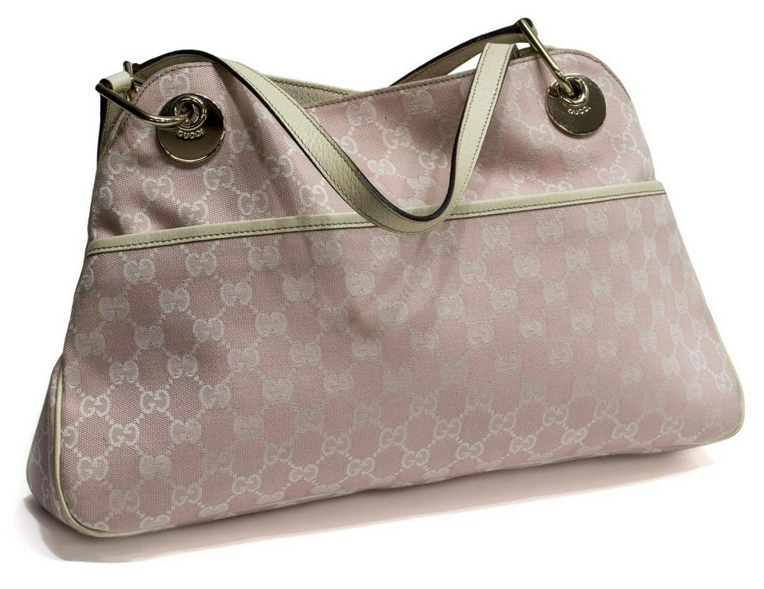 GUCCI LIGHT PINK MONOGRAM CANVAS ECLIPSE PURSE: Gucci Eclipse tote in light pink monogram canvas with white leather piping and handles, long slot pocket to one side, gold tone hardware, snap top opens to lined interior with cell and slot pockets, r