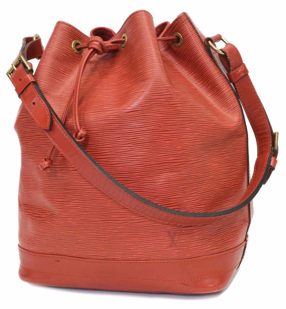LOUIS VUITTON 'NOE' RED EPI LEATHER BUCKET BAG: Louis Vuitton "Noe" bucket bag, in red Epi leather, with brass hardware, adjustable flat shoulder strap, drawstring closure at front face opening to red Alcantara lined interior, creasing, marks along
