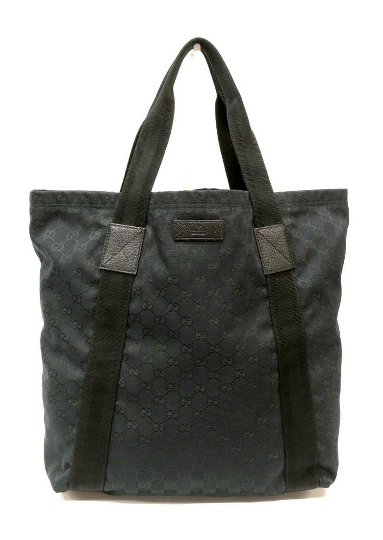 GUCCI BLACK MONOGRAMMED CANVAS TOTE: Gucci black monogrammed canvas tote, one large and one small pocket along interior walls, two flat-top handles, wear and creasing to the canvas, soiling to straps, measurements for shipping purposes o