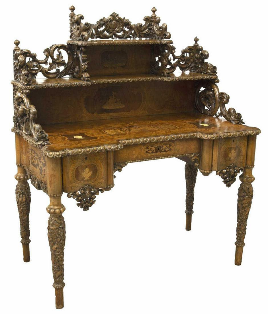 FINE GERMAN CARVED & INLAID WALNUT WRITING DESK: Fine German carved and inlaid walnut writing desk, 19th c., superstructure with two shelves, foliate-carved bracket supports with winged dragons, top framed by egg and dart molding, marquetry allegori