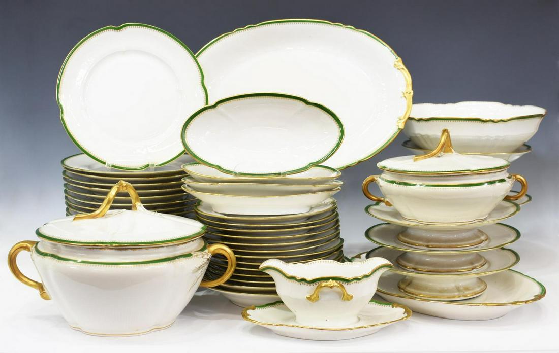(48) FRENCH LIMOGES PARCEL GILT DINNER SERVICE: (lot of 48) French Limoges porcelain partial dinner service, having white ground with green border, gilt scalloped rim, comprising: (18) dinner plates, approx 9.5"diam; (12) salad plates, approx 8.25"