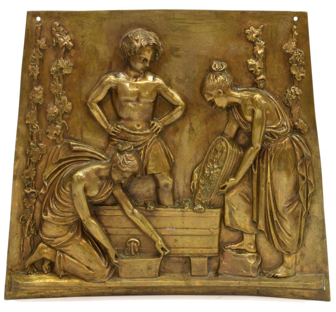 FRENCH BRONZE BAS RELIEF PLAQUE AFTER CLODION: French bronze figural bas relief plaque, late 19th c., trapezoidal form, depicting a classical scene of wine making, after Clodion (Claude Michel, France, 1738-1814), approx 12.75"h, 14.5"w, 9lbs Star