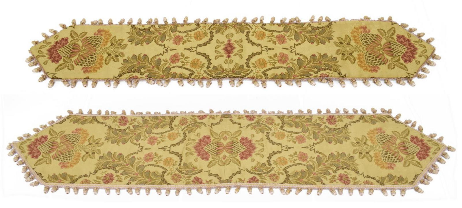 (2) FLORAL JACQUARD TABLE RUNNERS: (lot of 2) Floral jacquard table runners, similarly styled, accented by pink and gold trim with tassels, largest: approx 73.5"l, 16.5"w; 3.75lbs total **Provenance: from a very fine San Antonio, Texas