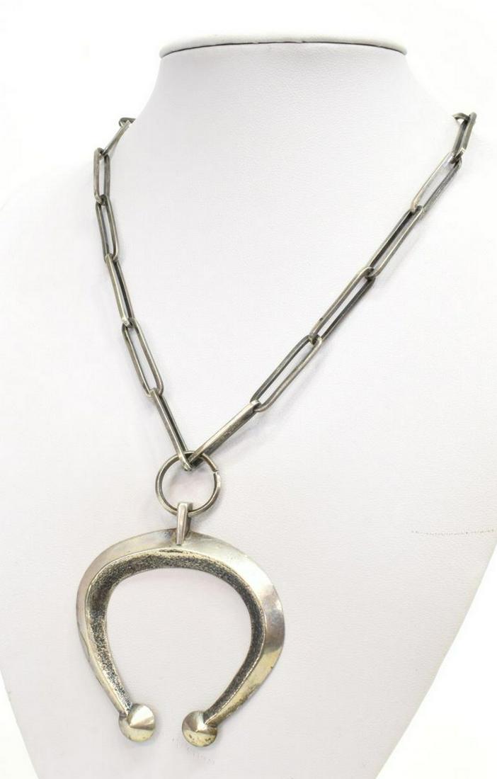 NAVAJO SAND CAST SILVER NAJA PENDANT NECKLACE: Native American silver necklace, Navajo, sand cast naja pendant, on long link chain, naja: approx 2 5/8"h, 2 3/8"w, necklace: approx 19"l (flat), 59 grams *Provenance: The family of Alfred A. King (Te
