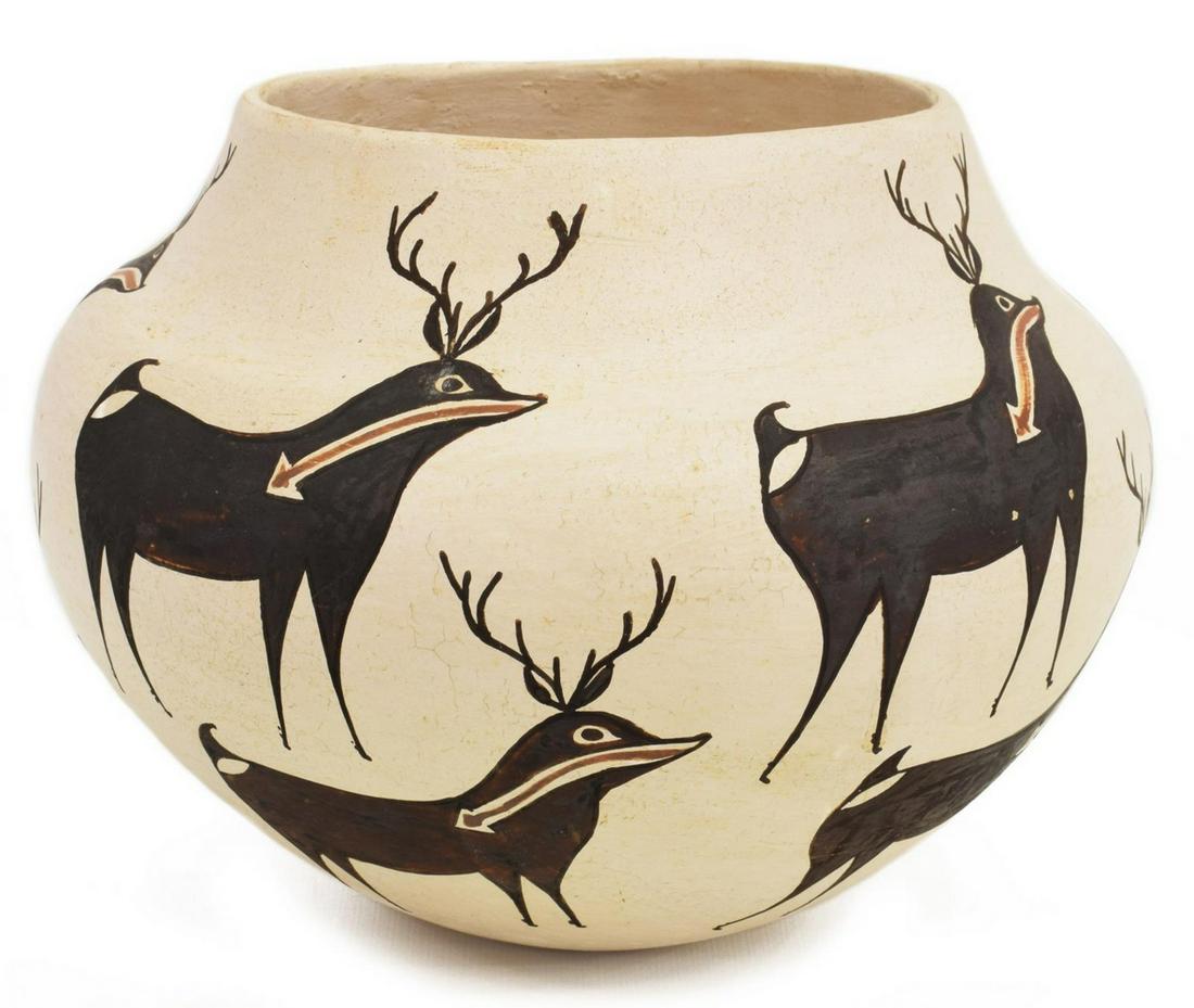 ROSE CHINO (ACOMA, 1928-2000) DEER POTTERY JAR: Native American Acoma pottery jar, 20th c., having a white ground with black and orange heartline deer figures, signed underfoot Rose Chino (1928-2000) / Acoma / New Mexico, approx 6.5"h, 8.25"diam, 1