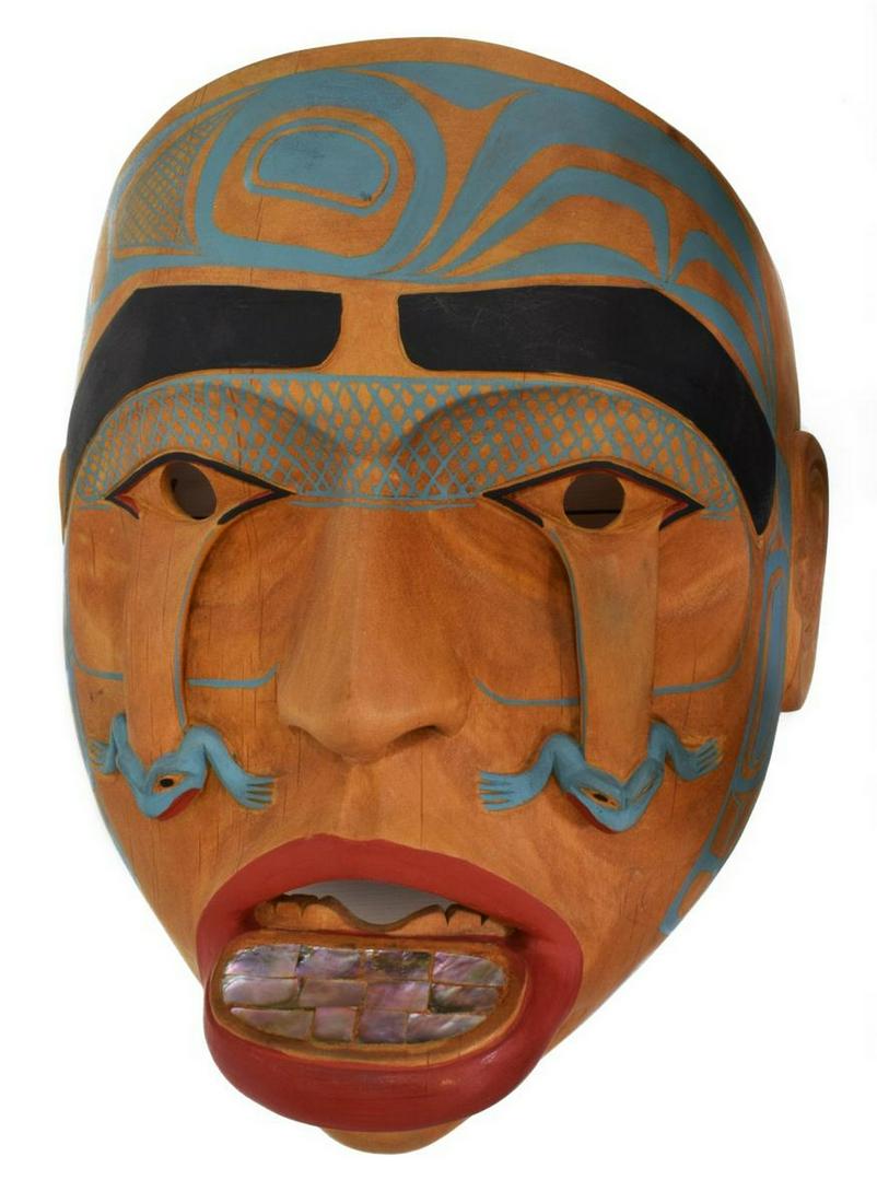 LELOOSKA (D.1996) CARVED & PAINTED WOOD MASK: Native American Pacific Northwest carved wood mask, signed to the reverse Lelooska (Don Lelooska, Kwakwaka'awkw, 1933-1996), with polychrome painting, frogs decorating the cheeks and a stretched lower