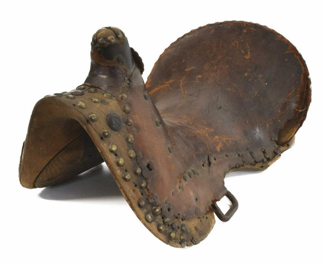 SMALL LEATHER & WOOD POMMEL SADDLE: Small pommel saddle, leather-clad wood frame, with metal nail head trim, back edge with tooling, approx 7.5"h, 15"l, 10"w, 3.5lbs Start Price: $60.00