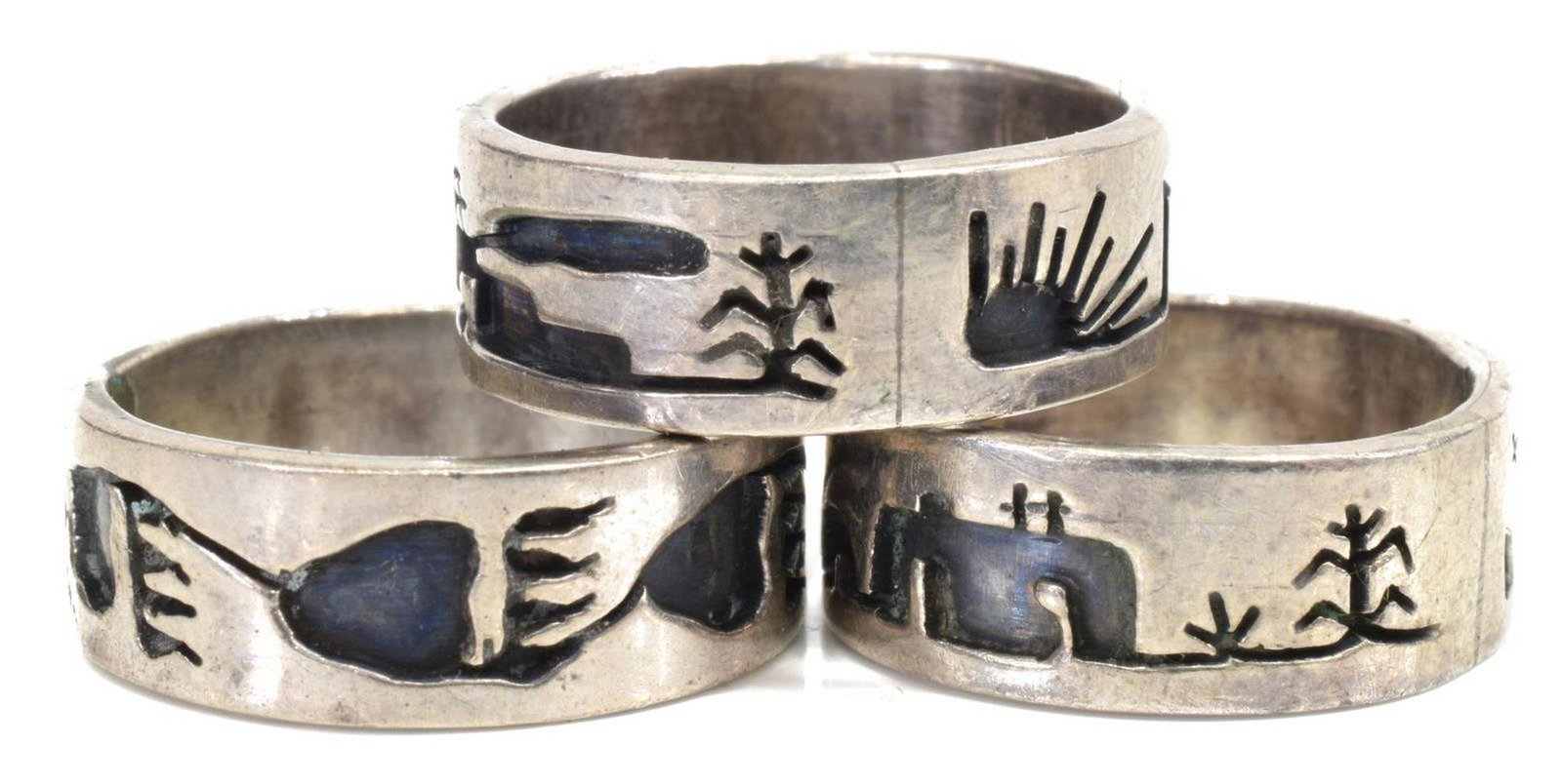 (3) VIDAL ARAGON SANTO DOMINGO PUEBLO SILVER RINGS: (lot of 3) Native American silver rings, Vidal Aragon (Santo Domingo Pueblo, 1923-2015), with pueblo and bear paw motifs, stamped VA, sizes ranging from approx 5-6.5; 12 grams total *Provenance: The f