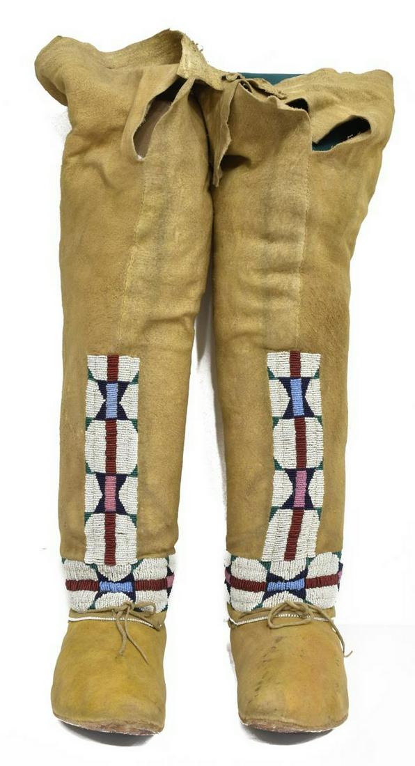 NATIVE AMERICAN BEADED HIDE MOCCASINS & LEGGINGS: (pair) Southern Cheyenne women's hide moccasins and leggings, c. 1890-1910, with white, green, red, pink, and blue beading, tie closure around ankle, approx 20"h, 9.75"l, 3.25"w Start Price: $800.00