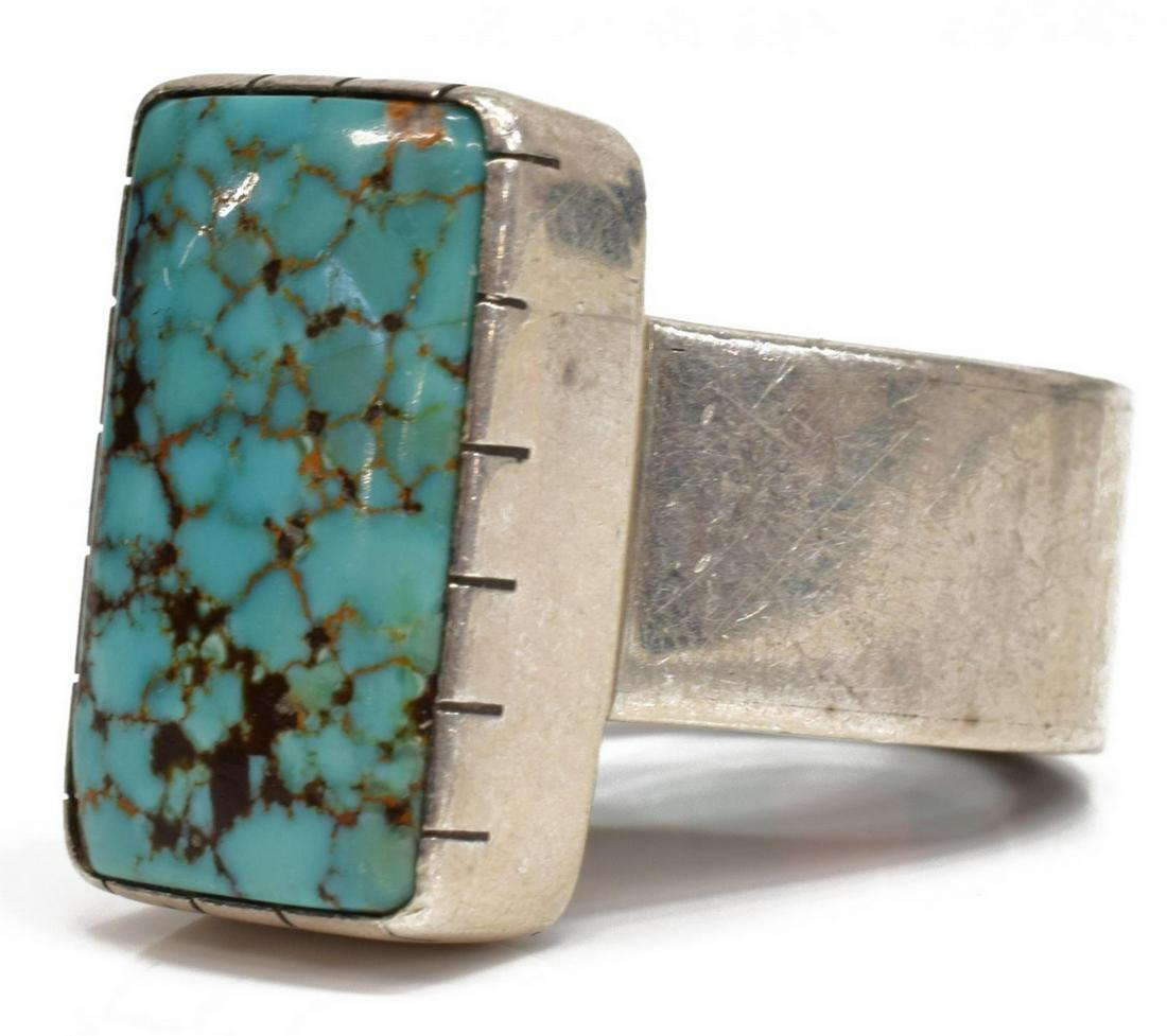 BOBBY TEWA (B.1948) MOSAIC INLAY TURQUOISE RING: Native American silver ring, signed B. Tewa (Bobby Tewa, San Juan Pueblo, b.1948), central bezel-set turquoise stone, interior band with mosaic inlay of wood, turquoise and coral, approx size 4.75, 18