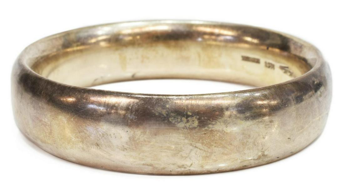 MODERNIST HANS HANSEN 925 STERLING SILVER BANGLE: Heavy Modernist 925 sterling silver bangle bracelet, Hans Hansen (Denmark, 1884-1940), c. 1970's, marked to the interior, 2.5"diam (interior), 82 grams *Provenance: The family of Alfred A. King (Texas