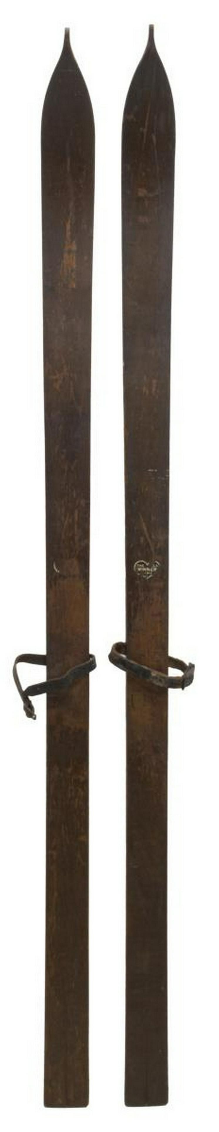 (PR) ANTIQUE LEATHER FOOT STRAP WOOD SKIS: (pair) Antique wood skis, having leather foot straps with iron buckles, on a wood base, approx 59.25"l, 2.5"w, 3.5lbs total Start Price: $50.00