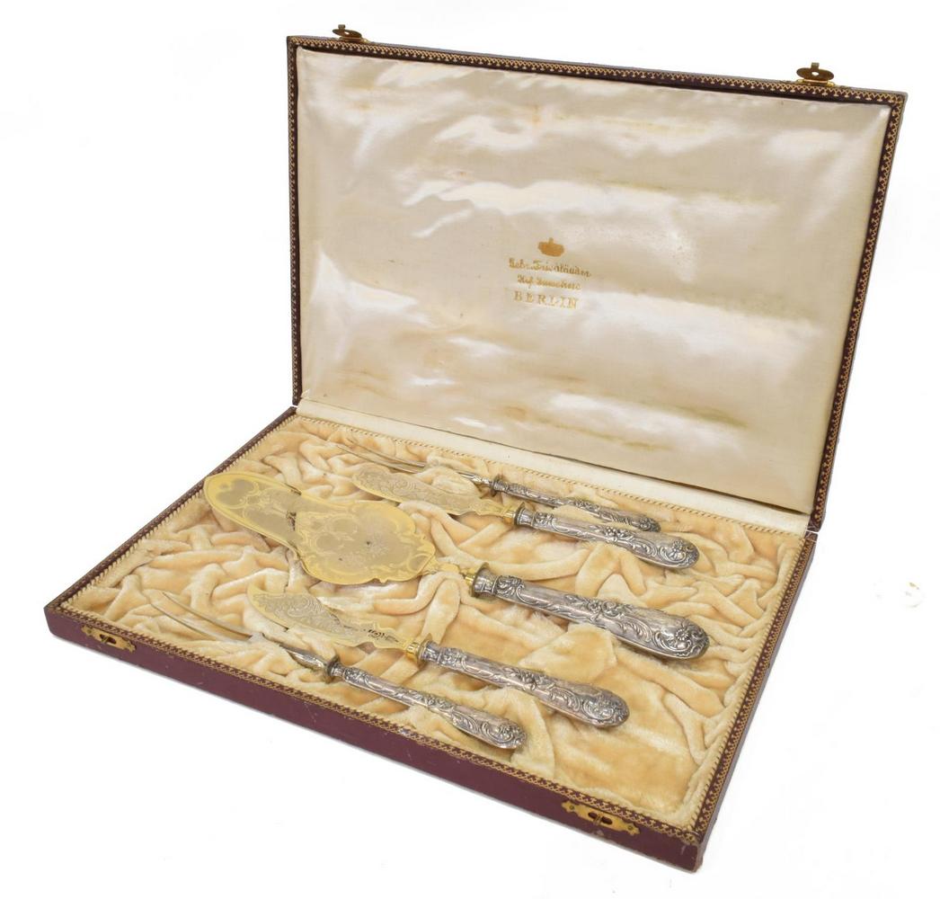 (5) GERMAN 800 SILVER FISH SERVING FLATWARE SET: (5 piece) German 800 silver flatware set, including: (2) two-prong forks, approx 8"l, (1) butter knife, with gilt wash, approx 8"l, (1) fish knife, with gilt wash, approx 8 1/8"l, (1) server, with gil