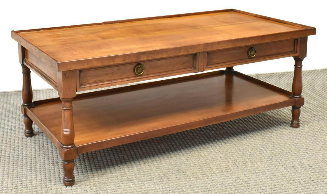 ITALIAN WALNUT TWO-TIER RECTANGULAR COFFEE TABLE: Italian walnut two-tier coffee table, 20th c., rectangular top above two drawers extending to either side, rising on turned legs, joined by lower shelf, approx 19"h, 47"w, 24"d Start Price: $100.00
