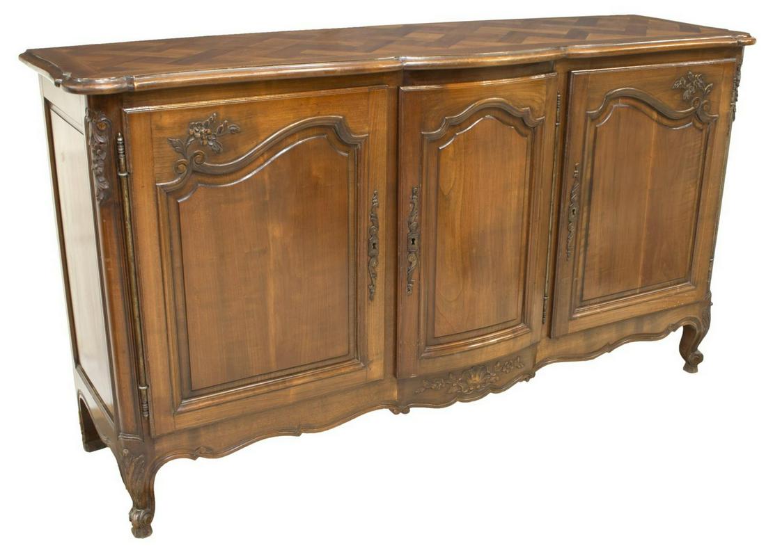 FRENCH PROVINCIAL LOUIS XV STYLE WALNUT SIDEBOARD: French Provincial Louis XV style walnut sideboard, 20th c., with parquetry top, over three cabinet doors on long exterior hinges, center bow-front door, interior fitted with shelves and two small draw