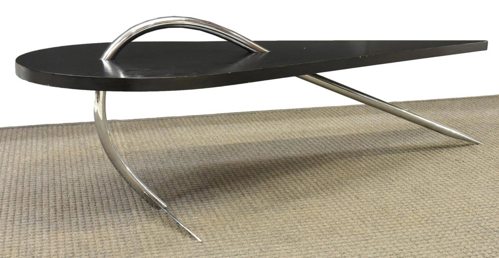 ITALIAN MODERN DESIGN COFFEE TABLE: Italian modern coffee table, c.1970s, having shaped ebonized top, above structural chrome base, approx 19.25"h, 59.5"w, 20"d Start Price: $150.00