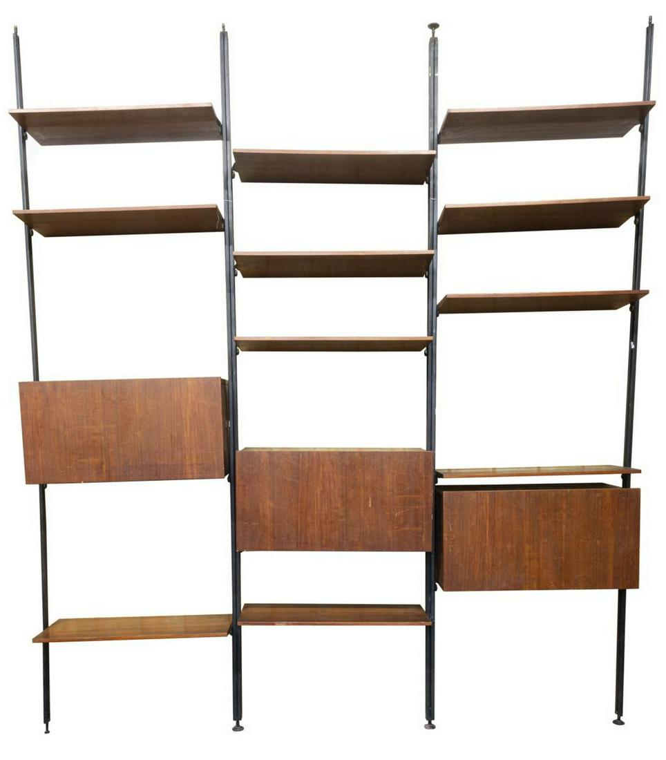 ITALIAN MID-CENTURY MODERN TEAK WALL UNIT BOOKCASE: Italian mid-century modern teak wall unit bookcase, c.1960s, divided into three modules, featuring eleven adjustable shelves, three cabinets with drop down surface, (one) revealing three compartment i