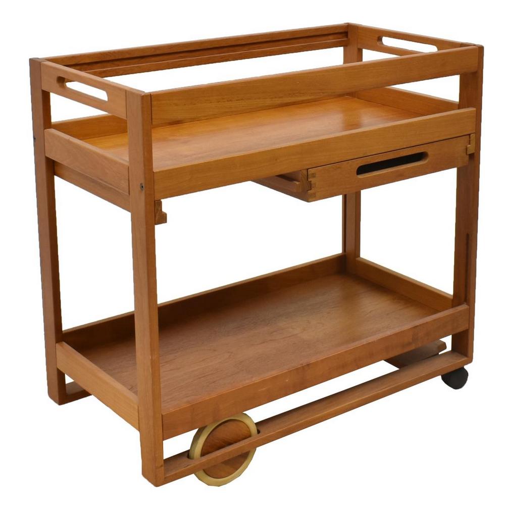 DANISH MODERN NISSEN TEAK TROLLEY SERVICE CART: Danish modern tea trolley/ service cart, designed by Jens Quistgaard (1919-2008) for Richard Nissen, c.1970s-1980s, two tiers, top tier with removable rails, single frieze drawer, on wheels, approx 31