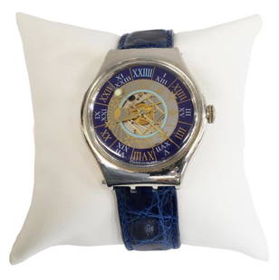 ESTATE GENTS SWATCH TRESOR MAGIQUE PLATINUM WATCH: Gents Vintage Swatch Tresor Magique platinum wristwatch, c. 1993, a limited edition numbered 07562/ 12999, blue and gold enameled dial with silver inner dial and moon phase design, Roman numeral twent