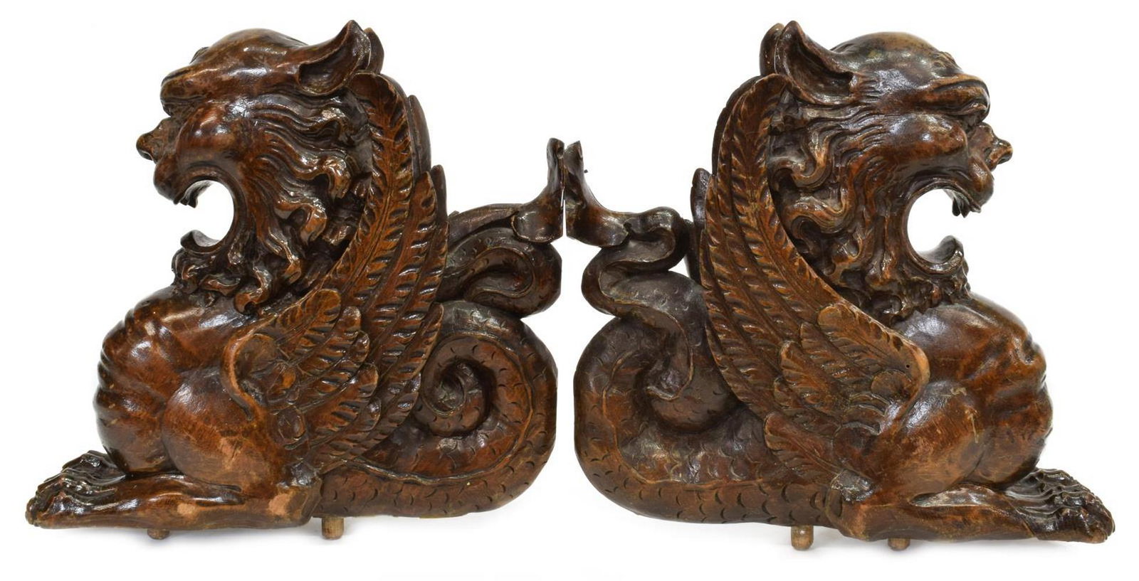 (2) ITALIAN ARCHITECTURAL CARVED GROTESQUES: (lot of 2) Italian carved architectural elements, early 20th c., depicting grotesque beasts with lion mask, wings, and serpent tail, approx 12"h, 13"w, 3.5"d; 9lbs total Start Price: $100.00