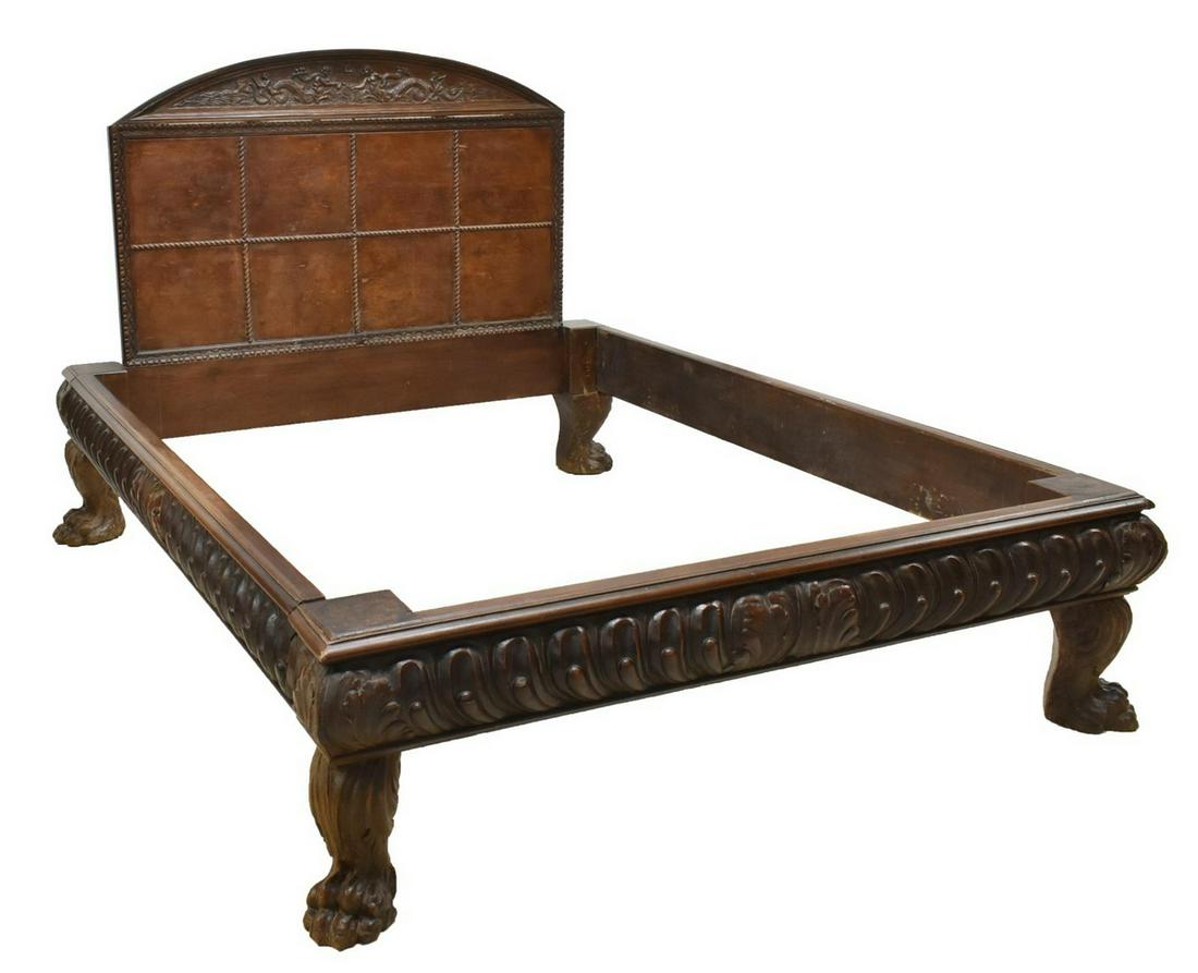 ITALIAN BAROQUE STYLE CARVED WALNUT BED: Italian Baroque style walnut bed, mid 19th c., featuring center design of water nymphs in waves, atop paneled burled headboard, fitted on box frame having carved shell and scroll designs, rising on ov