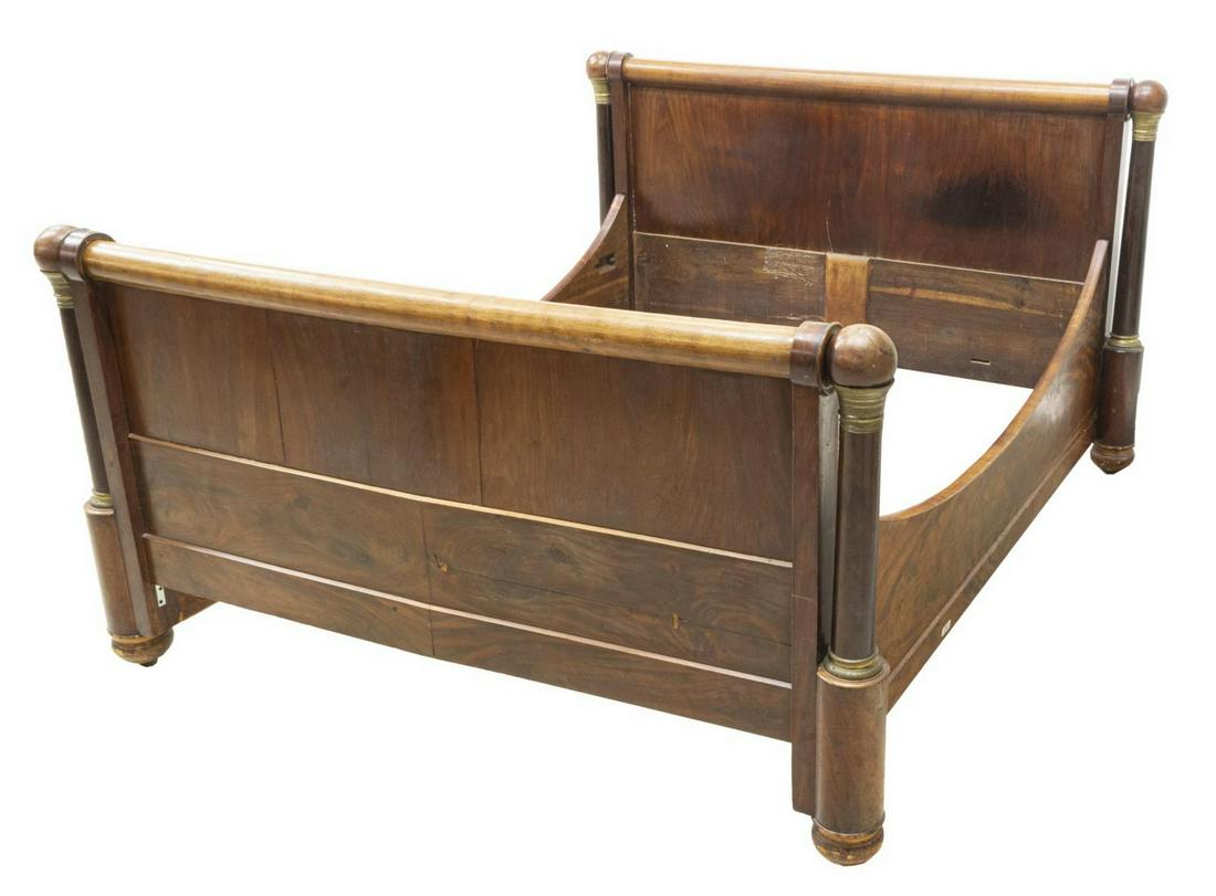 FRENCH EMPIRE STYLE MAHOGANY BED: French Empire style mahogany bed, 19th c., the headboard and footboard flanked by ball finial topped rounded standards with gilt metal accents, exterior: approx 42.5"h, 66.75"w, 77.5"d, interior: appr