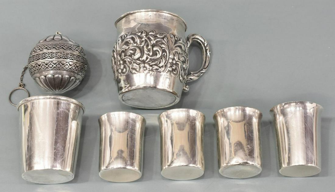 7)GROUP STERLING SILVER CUPS & TEA STRAINER / BALL: (lot of 7) American sterling drinkware and tea items: (1) Gorham, ornately pierced tea strainer / ball, marked on rim, approx 2"h; (4) small cups, assorted makers include Web, Lunt, Rogers, Lunt & Bow
