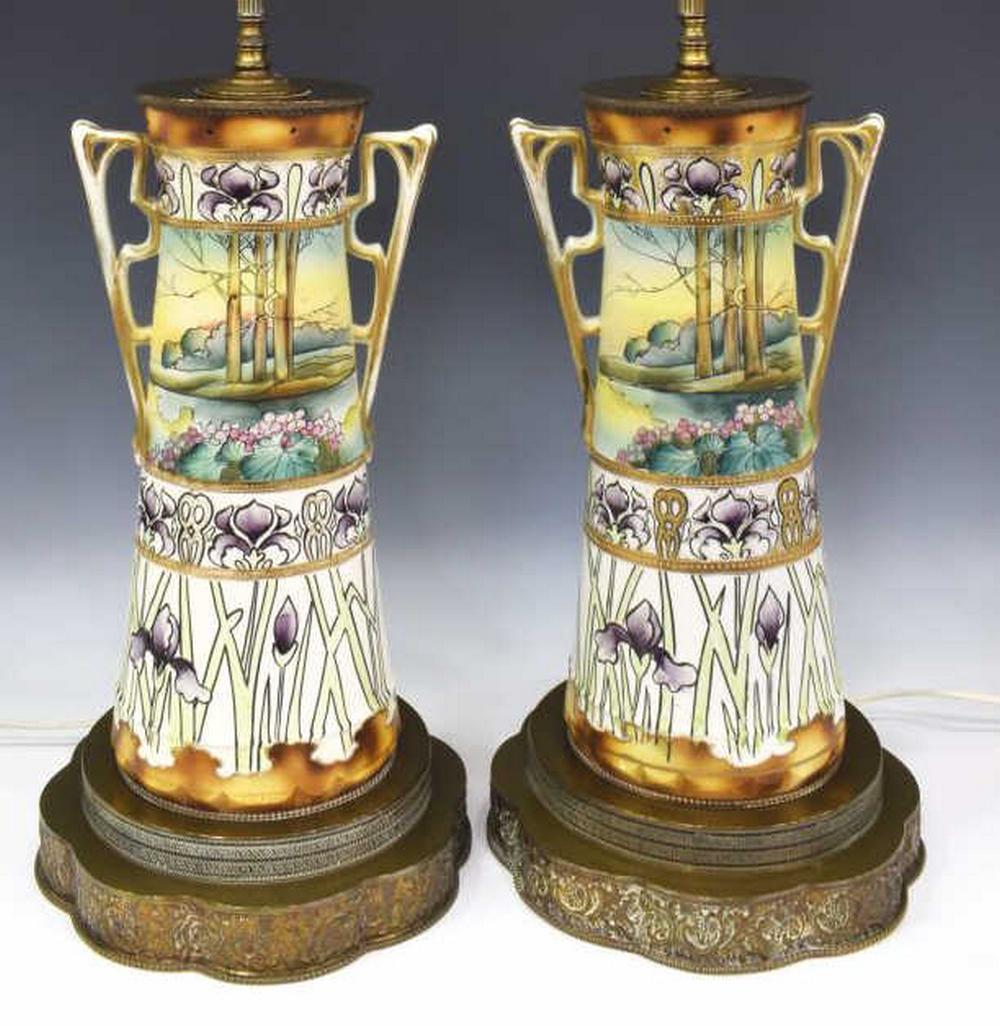 (2) NIPPON STYLE PORCELAIN VASES TABLE LAMPS: (lot of 2) Nippon style vases, now fashioned as table lamps, tapered cylindrical form with gilt bracket handles, bands with stylized irises and landscape view, raised moriage decoration, on a metal lo
