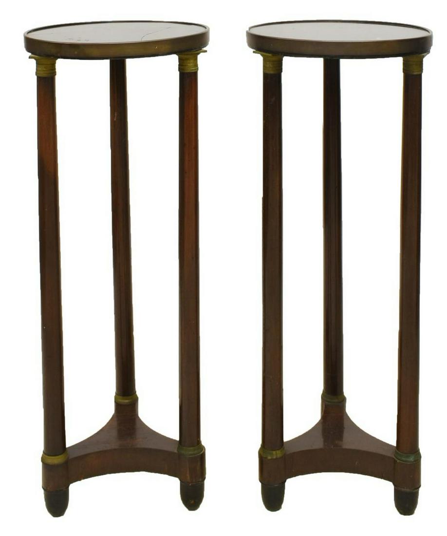 FRENCH EMPIRE STYLE MAHOGANY GUERIDONS TABLES: French Empire style mahogany gueridons, mid 19th c., circular inset marble top, three columnar supports with gilt metal capitals, conforming base, raised on cupped feet, approx 36.5"h, 14"diam Start P