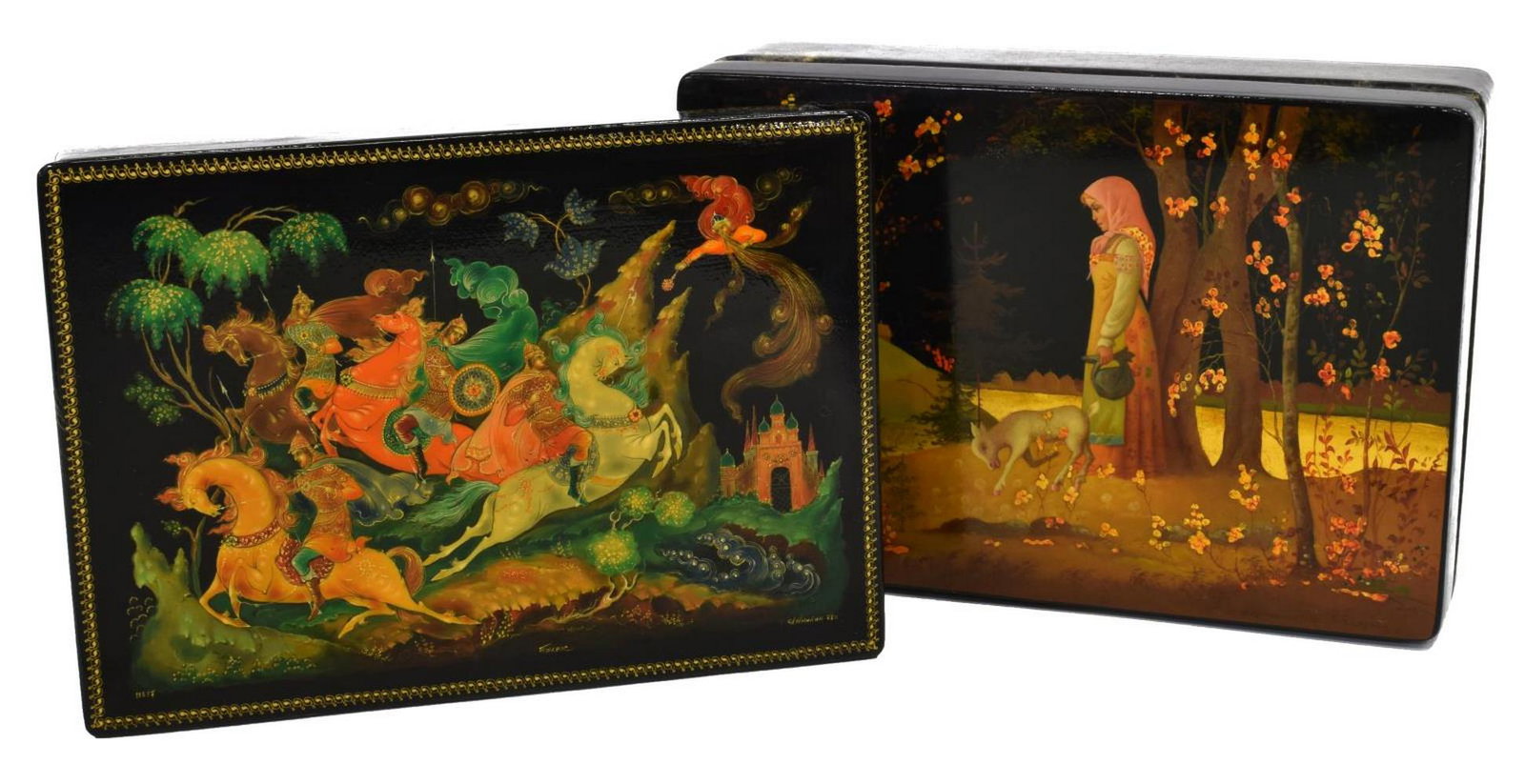(2) RUSSIAN LACQUERED FAIRYTALE BOXES: Russian lacquered fairytale boxes, comprising: (1) having scene of warriors on horses, signed and numbered to lid, approx 1.75"h, 8"w, 5.75'd; (1) having scene with castle to lid, signed and dated 198