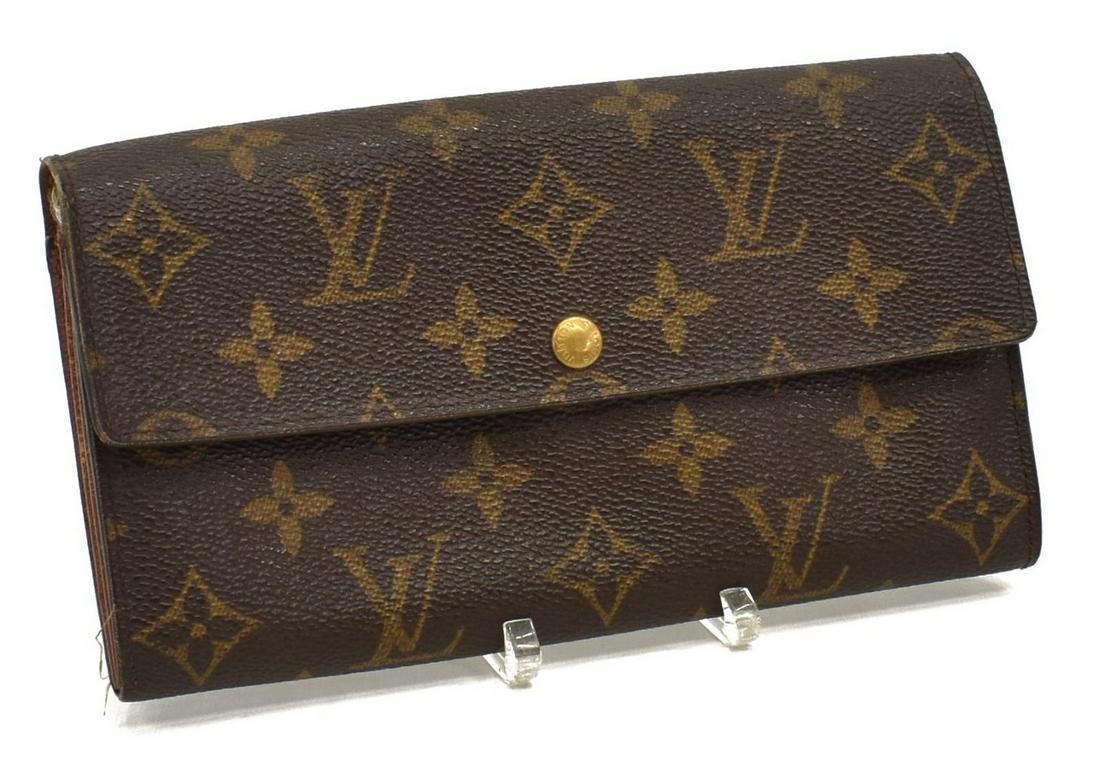 LOUIS VUITTON 'PORTE-MONNAIE' MONOGRAM WALLET: Louis Vuitton "Porte-Monnaie Credit" wallet, in brown and tan monogram coated canvas, with brass hardware, snap closure at front flap opening to sectioned interior with central zipper compartment, two