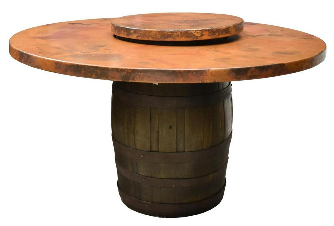 COPPER LAZY SUSAN TABLETOP WINE BARREL TABLE: Center table, 20th c., hammered copper-clad lazy Susan tabletop, supported by an oak stave barrel with iron strapping, approx 36.5"h, 60"diam, lazy Susan: approx 26"diam Start Price: $300.00