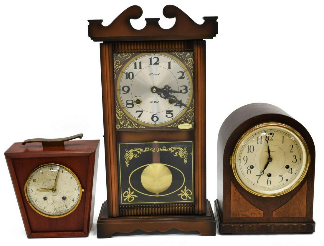 (3) SHELF CLOCKS, ALARON, SETH THOMAS, HERSCHEDE: (lot of 3) Shelf clocks, 20th c., including: (1) Alaron, glazed door, lower tablet with gilt eglomise, dial with Arabic numerals, thirty-one day time and strike movement, lacking finials, approx 19"h,