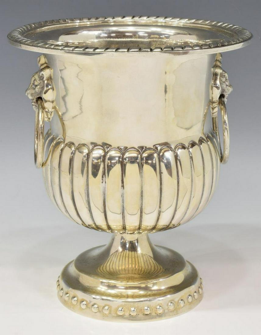 TANE MEXICO STERLING SILVER URN-FORM WINE COOLER: Sterling silver wine cooler, Tane, Mexico, campana form urn with lion mask ring handles, repousse gadrooning, on a pedestal base, marked underfoot, approx 8.25"h, 7.25"diam, 40.59ozt Start Price: $500