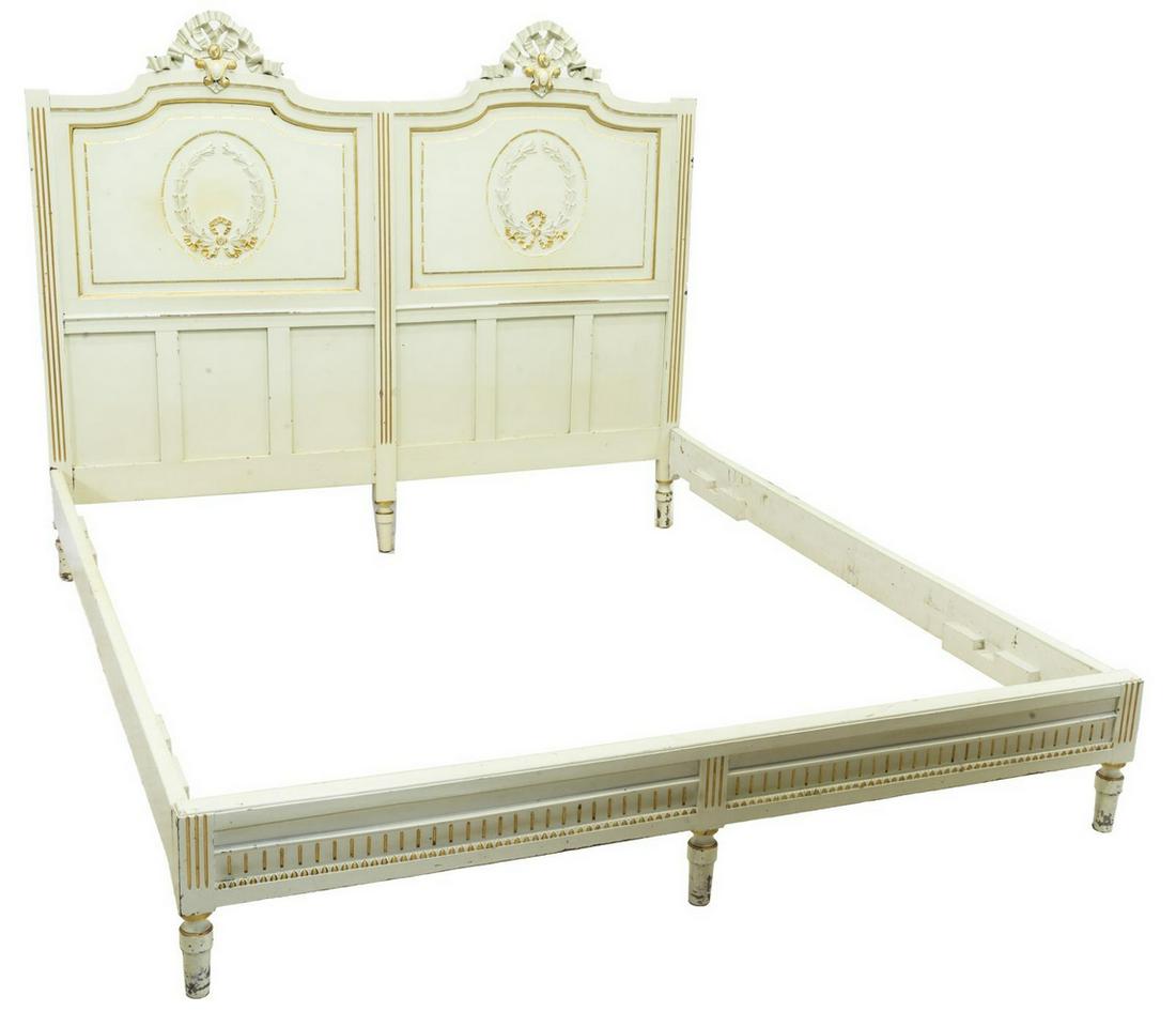 ITALIAN LOUIS XVI STYLE PAINTED BED: Italian Louis XVI style painted bed, 20th c., having ribbon crest, gold gilt running ornamentation to headboard and side rails, on cylindrical legs, approx exterior: 57.5"h, 70.5"w, 81.25"d, interior: