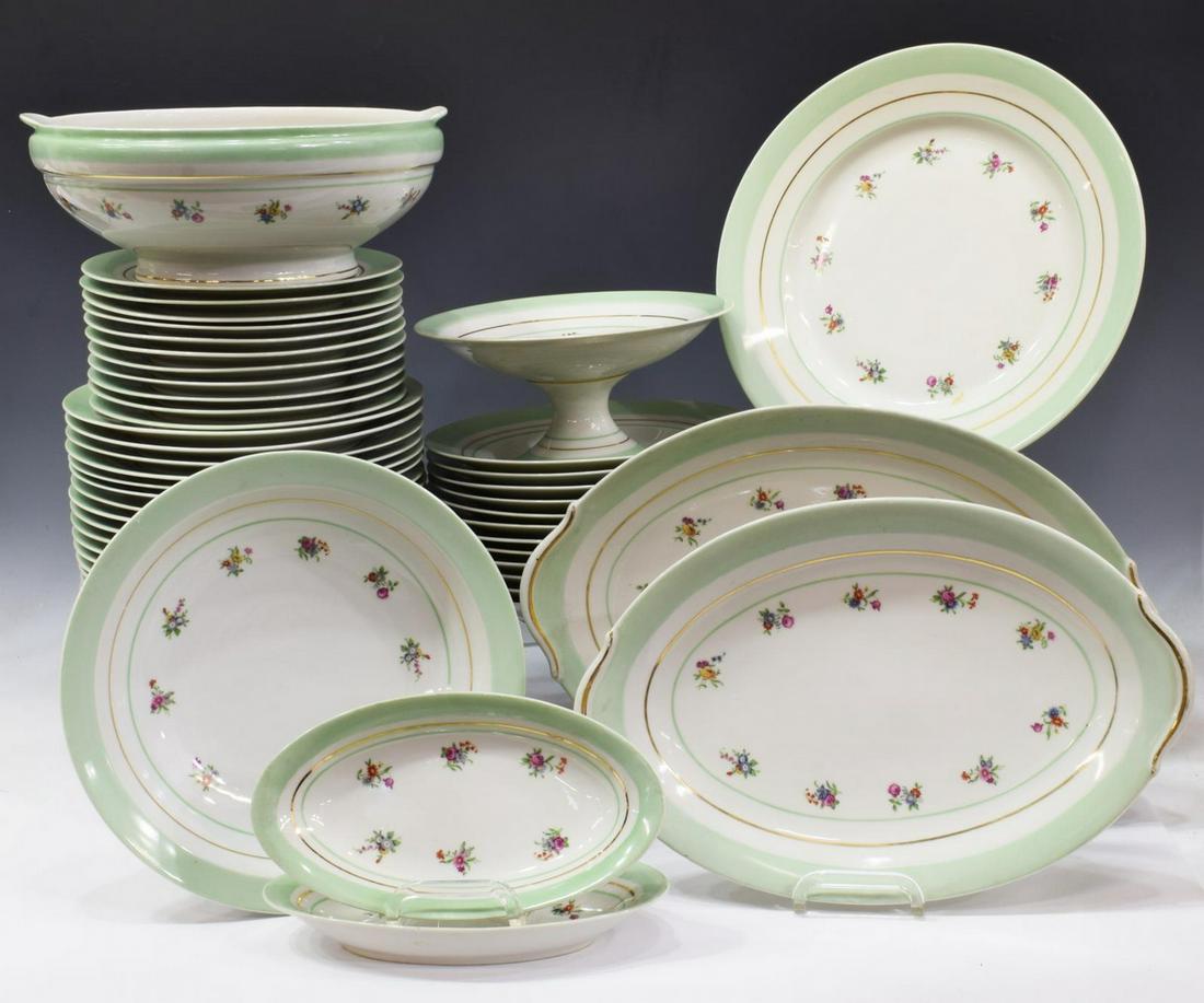 (63) FRENCH D.R.B. LIMOGES DINNER SERVICE: (lot of 63) French D.R.B. Limoges porcelain dinner service, 20th c., pale green rim, small polychrome floral sprays, including: (32) dinner plates, 9.5"diam, (12) soup bowls, 9"diam, (11) salad plates