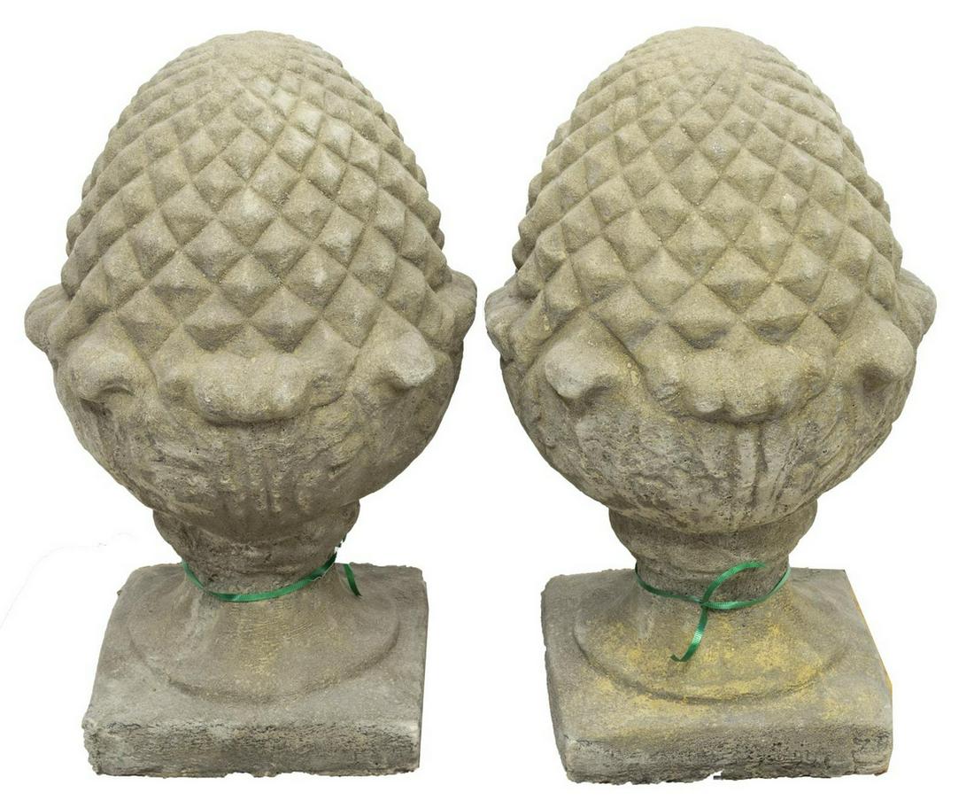 (2) ARCHITECTURAL CAST STONE PINEAPPLE PIERS: (lot of 2) Architectural cast stone garden statuary, in the form of a pineapple finial, rising from squared base, approx 20"h, 12.5"diam Start Price: $150.00