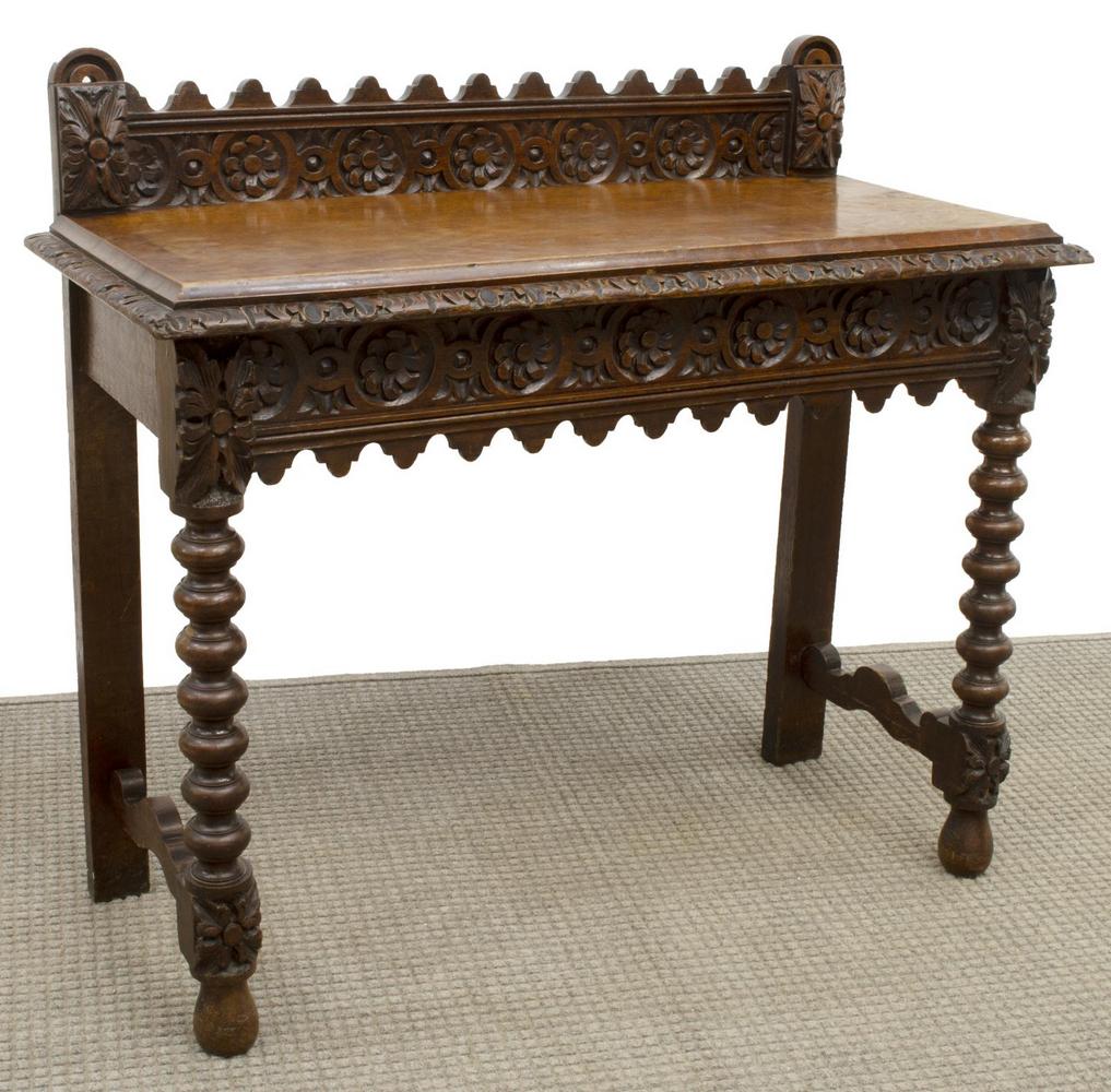 ENGLISH CARVED OAK CONSOLE TABLE: English oak console table, 19th c., raised gallery back, over rectangular top with molded edge, apron with rosette carving, rising on bobbin-turned legs, joined by side stretchers, approx 36.75"h, 41"