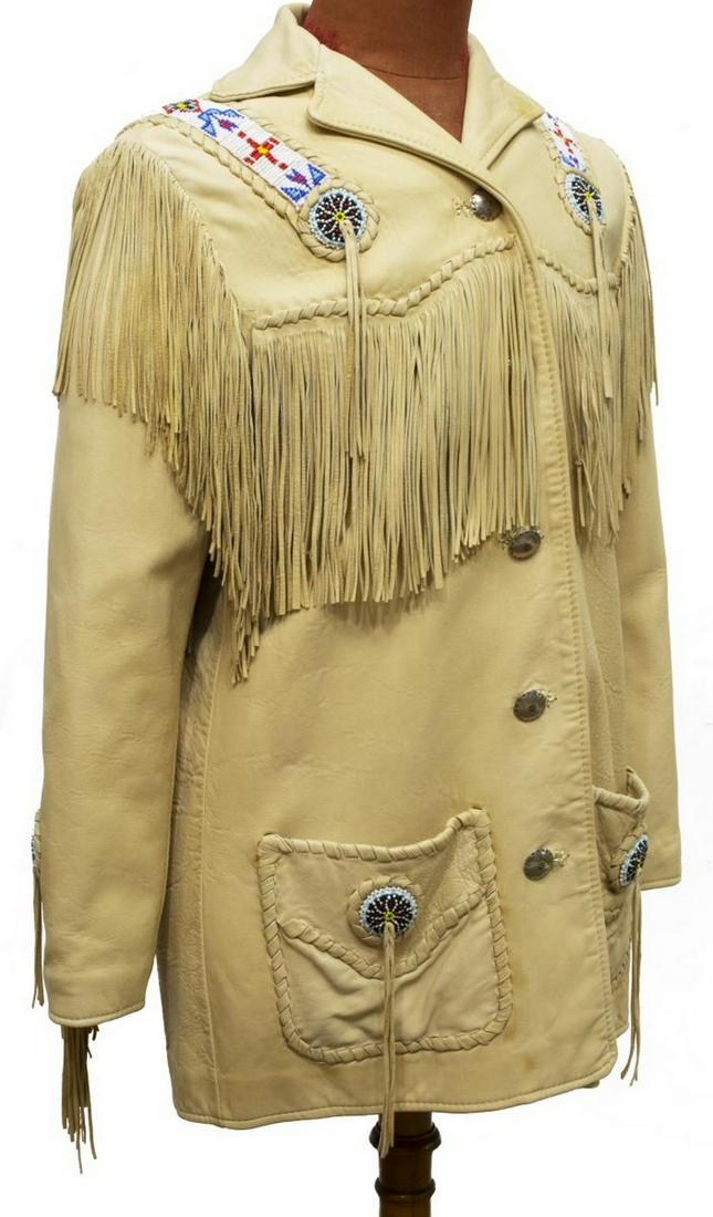 CREATIONS IN LEATHER NATIVE AMERICAN STYLE JACKET: Creations in Leather by Ritchie, Native American style jacket, fringed leather, having beading to arms, shoulders, and back, with silver fastens, marked size M, bust: approx 17"w, sleeves: approx 24"