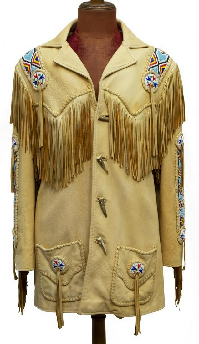 CREATIONS IN LEATHER NATIVE AMERICAN STYLE JACKET: Creations in Leather by Ritchie, Native American style jacket, fringed leather, having beading to arms, shoulders, and back, with antler fastens, marked size 42, bust: approx 17"w, sleeves: approx 24"