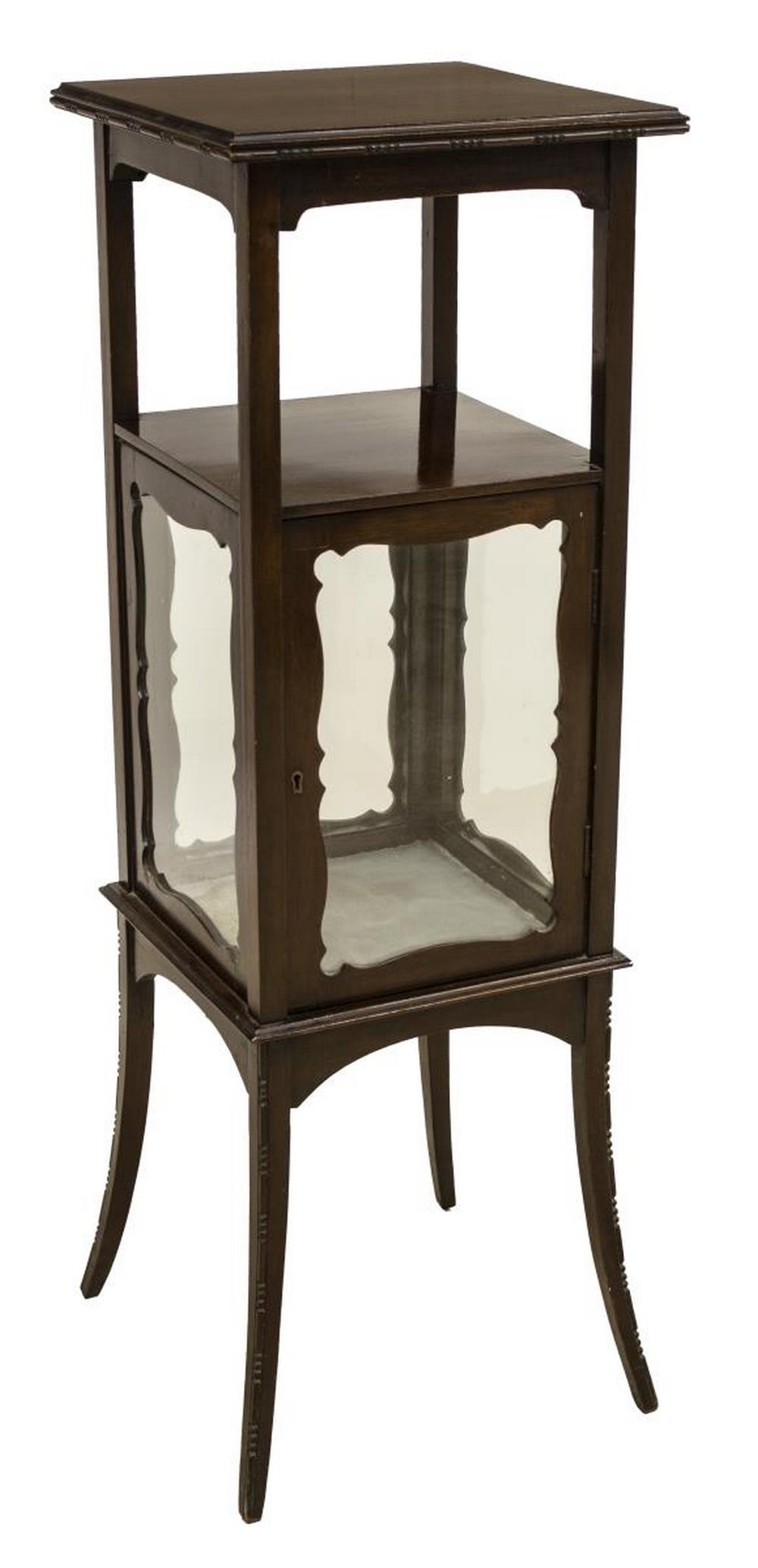 ENGLISH EDWARDIAN MAHOGANY VITRINE STAND: English Edwardian mahogany glazed vitrine stand, early 20th c., having raised square top, over glazed display cabinet, rising on slightly outswept legs, approx 39"h, 13"w, 18"d Start Price: $150.00