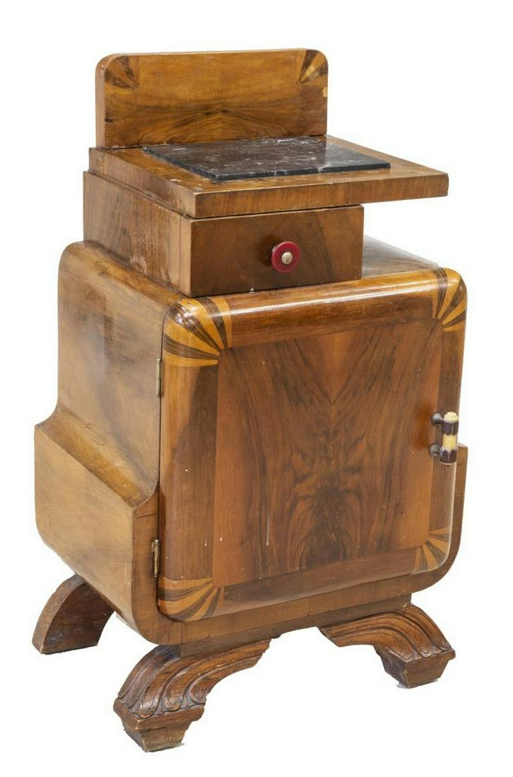 ITALIAN ART DECO MARBLE-TOP BEDSIDE CABINET: Italian Art Deco nightstand, c.1930s, inset marble top, over offset drawer, single cabinet door in bookmatched veneers, opening to interior shelf, rising on stylized carved base, approx 29.5"h, 20.5"w