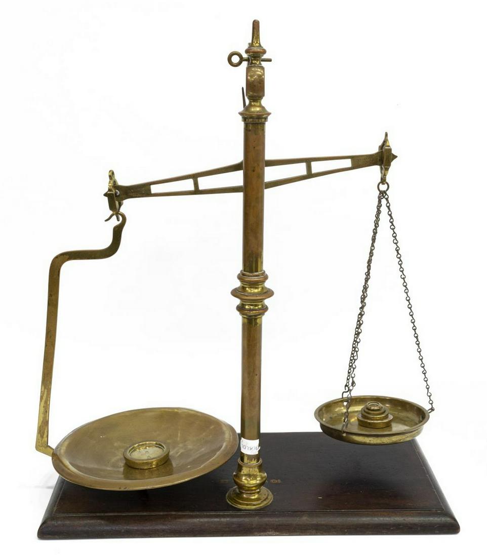 ENGLISH MAHOGANY & BRASS BALANCE SCALES W/ WEIGHTS: English mahogany and brass scales, WT & Avery Ltd, Birmingham, early 20th c., accompanied by (five) graduated weights, approx 23.75"h, 20"w, 10"d, 12.75lbs Start Price: $80.00
