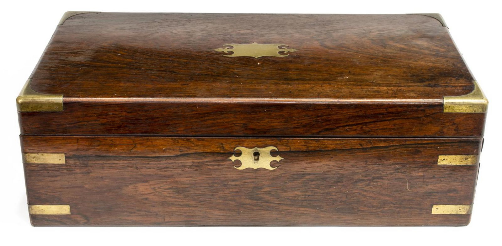 ENGLISH BRASS-BOUND MAHOGANY TRAVELING LAP DESK: English brass-bound mahogany traveling lap desk, early 19th c., shaped brass plate on lid with matched escutcheon, interior with worn velvet writing surface, open cubbies, pencil slot, removable slot 