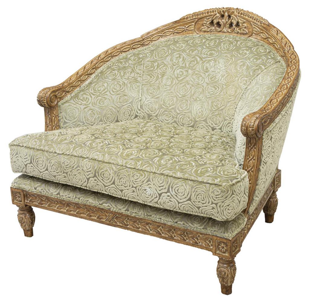 OVERSIZED FRENCH STYLE BERGERE ARMCHAIR: Oversized French style bergere armchair, late 20th c., frame with floral crest, upholstered rounded back and cushion seat, closed arms ending in acanthus scrolled handholds, rising on tapered legs, ap