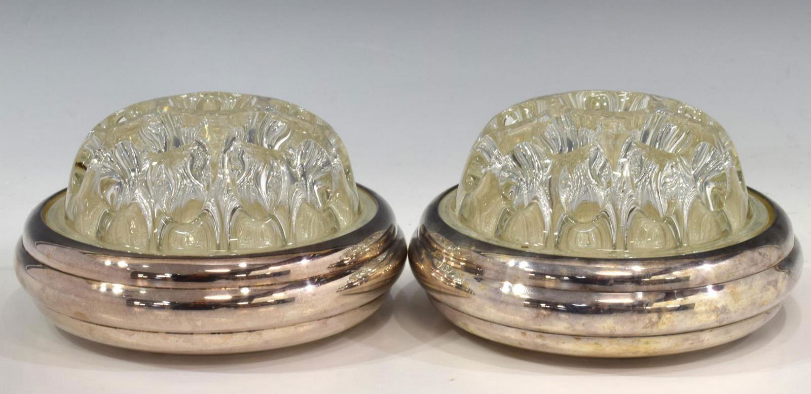 (2) CHRISTOFLE GLASS & SILVER PLATE FLOWER FROGS: (lot of 2) French Christofle silver plate flower frogs, with glass insert, silver plate base, Collection Gallia mark underfoot, glass with molded mark Reims, approx 3"h, 4.75"diam; 2.5lbs total (for s