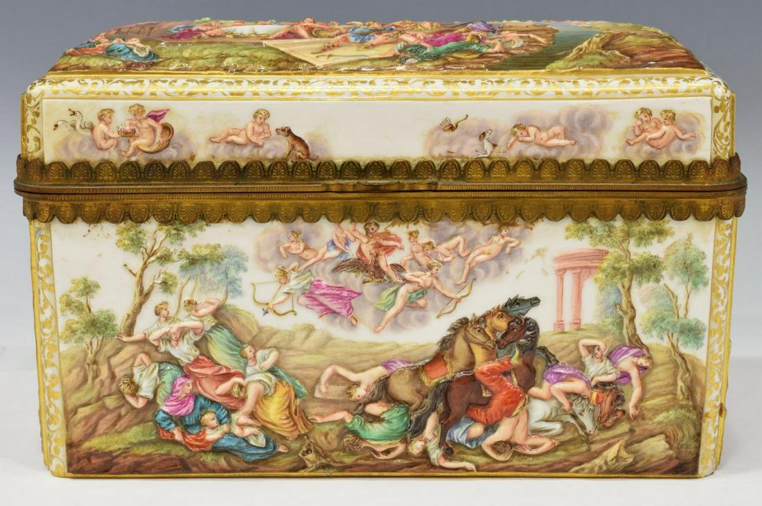 MEISSEN ORMOLU-MOUNTED PORCELAIN TABLE CASKET: Meissen porcelain jewelry/ table casket, in the Capodimonte style, late 19th/ early 20th c., of rectangular form, gilt foliate rinceau, framing molded battle scenes from mythology, hinged top opening