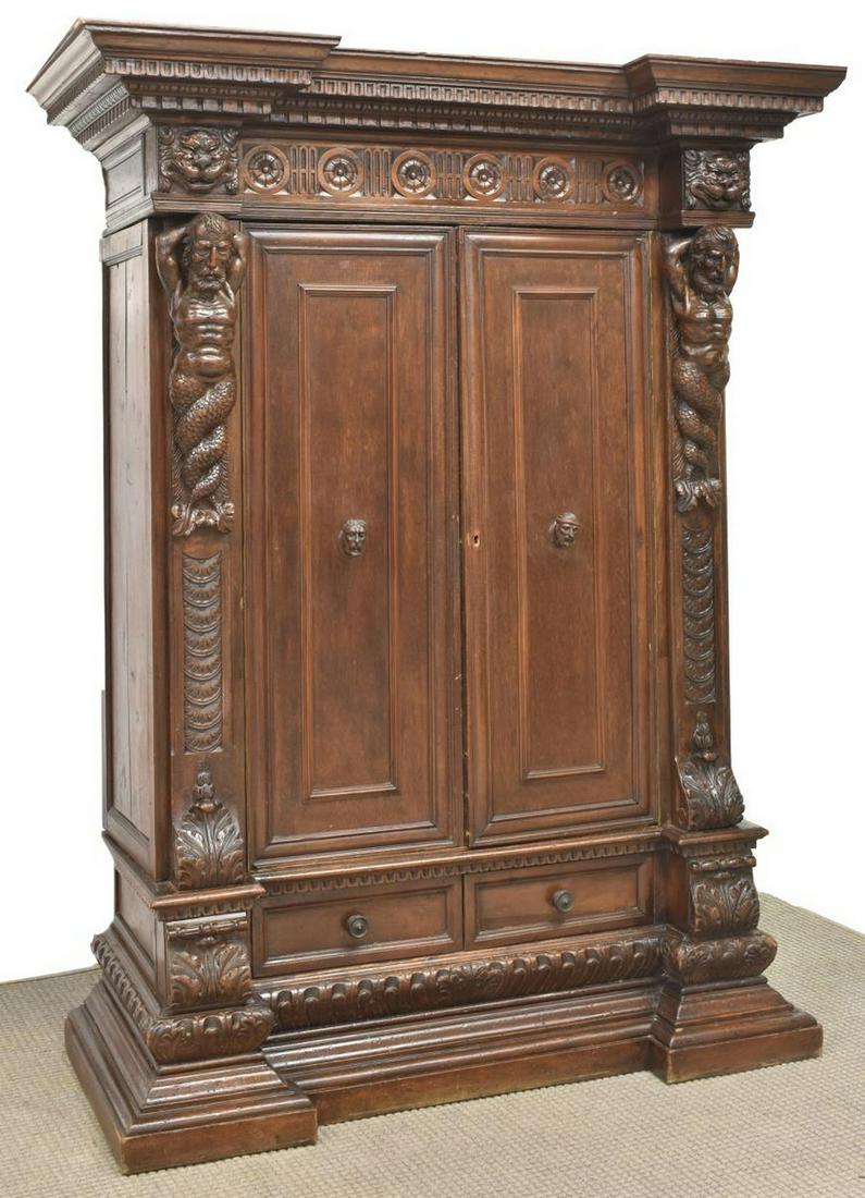 ITALIAN RENAISSANCE REVIVAL FIGURAL CARVED CABINET: Italian Renaissance Revival figural carved cabinet, 19th c., the stepped molded cornice over two doors with figural pulls, flanked by 23"h Glaucus figures, all rising the stepped base with drawers, ap