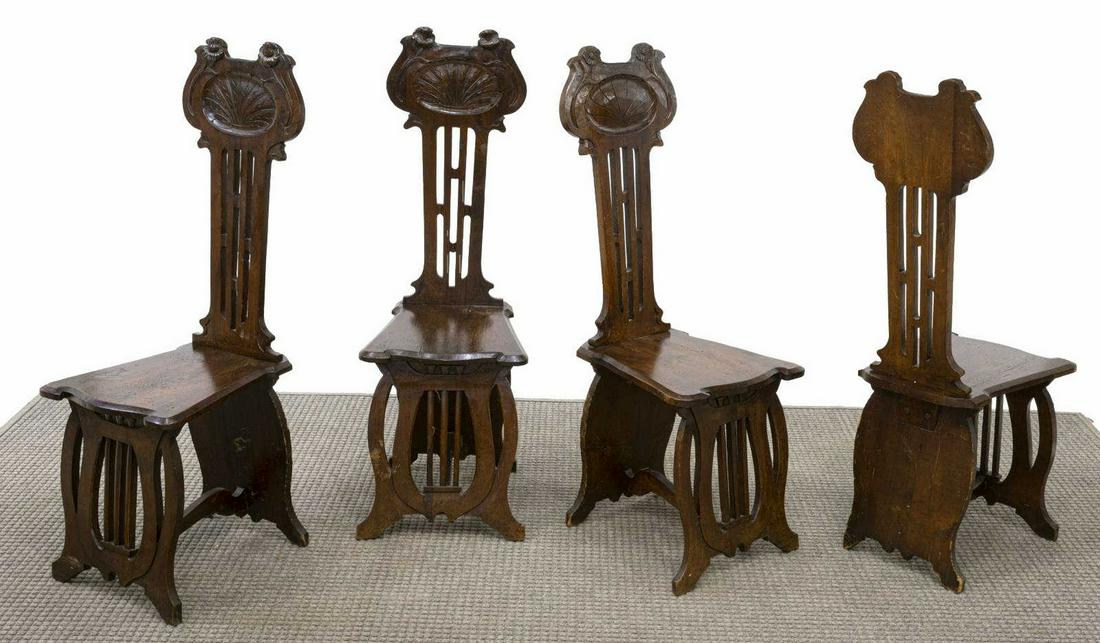 (4) FRENCH ART NOUVEAU WALNUT SIDE CHAIRS: (lot of 4) French Nancy School Art Nouveau carved walnut hall chairs, early 20th c., floral and shell motif on back rail, over solid seat, front legs connected in form of harp, approx 43"h, 16"w, 14.7
